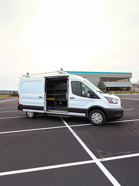 E-transit cargo van in white parked in a large lot