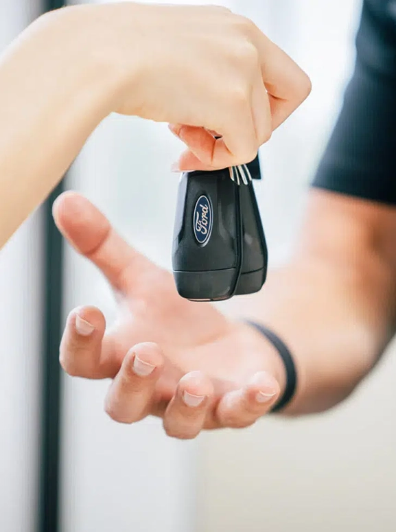 keys are being handed over after a financing agreement in Phoenix